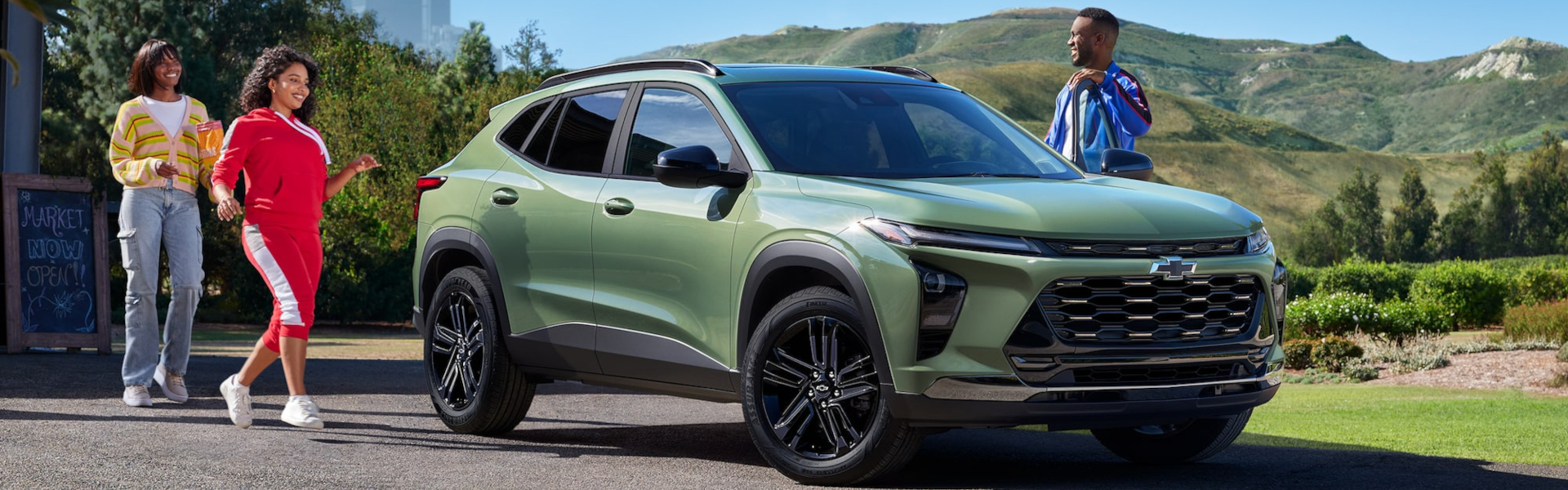A 2025 Chevrolet Trax parked in front of a mountain backdrop, showcasing its sleek design and rugged appeal.